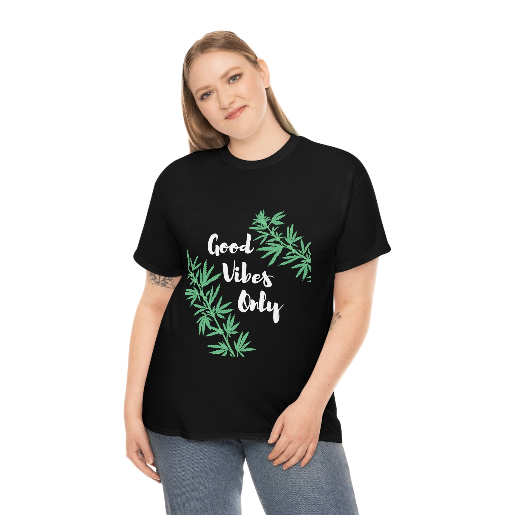 A woman wearing a black t-shirt that says Good Vibes Only Leaf.