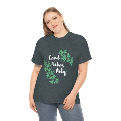 A person wears the Good Vibes Only Leaf T-Shirt, a dark green top decorated with cannabis leaf graphics.