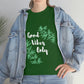 a woman wearing a green Good Vibes Only Leaf T-Shirt.