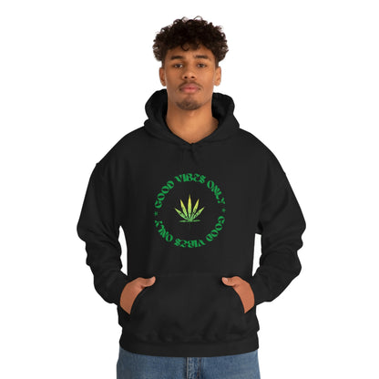 A man wearing a black good vibes only weed sweater