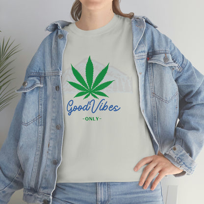 a woman wearing a jean jacket and a t - shirt that says Good Vibes Only Mountain Tee.