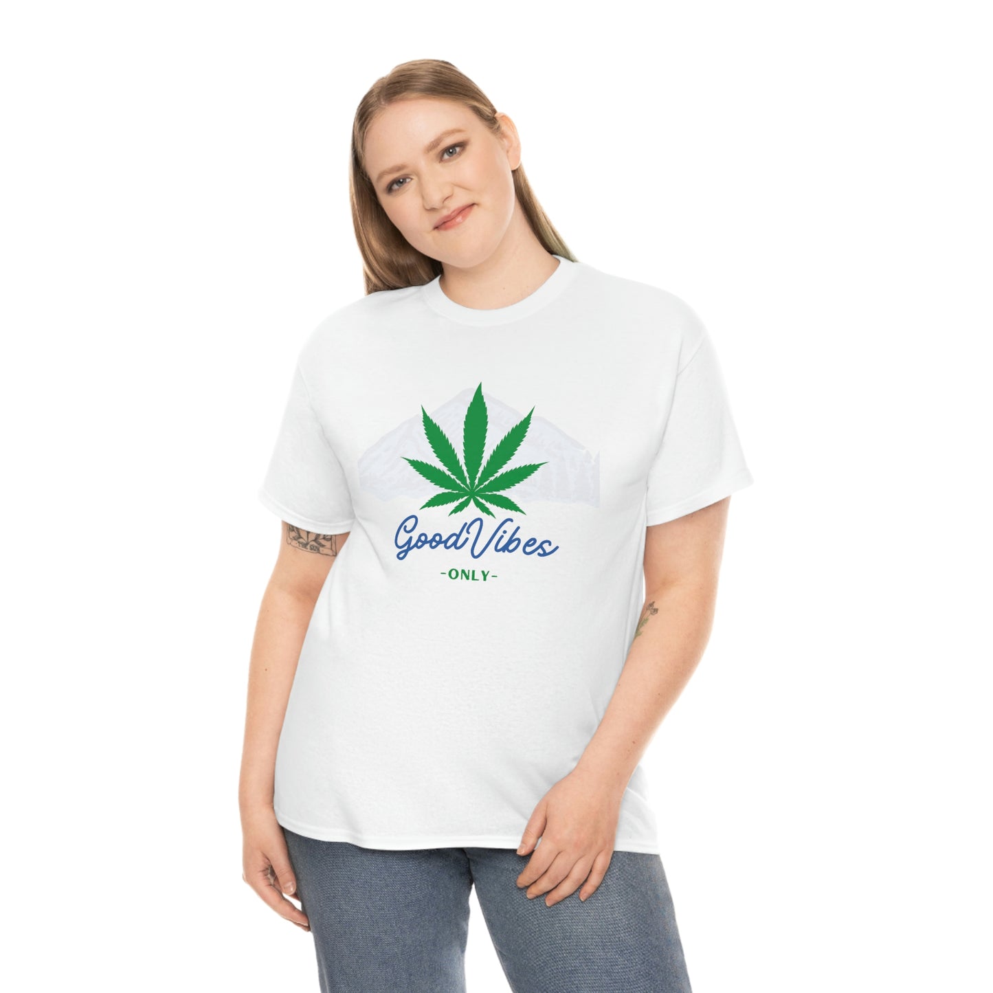 a woman wearing a white t-shirt with a Good Vibes Only Mountain Tee on it.