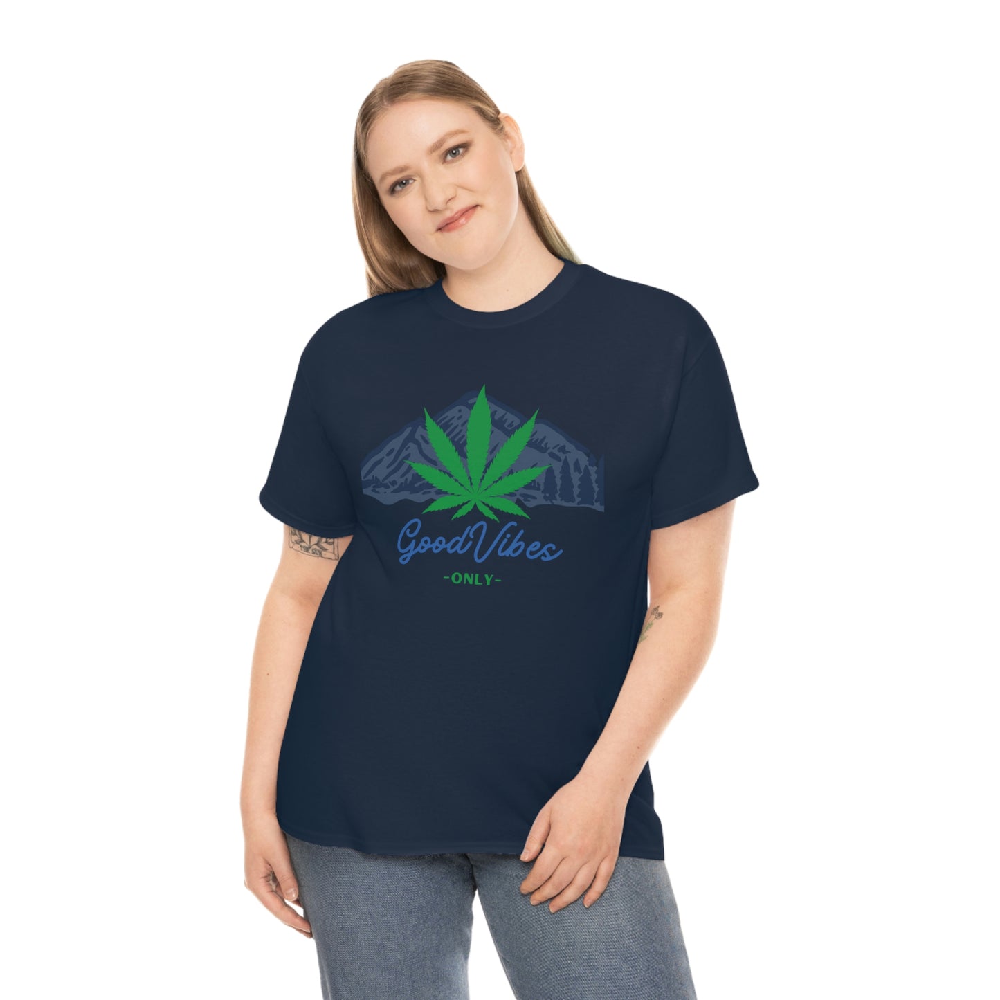 a woman wearing a navy Good Vibes Only Mountain Tee with a marijuana leaf on it.