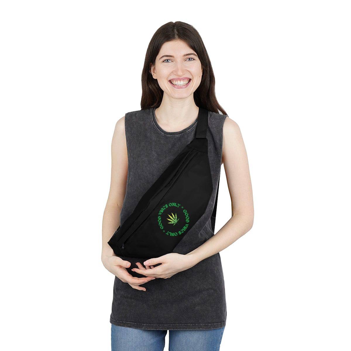 a woman wearing a black fanny pack with the words good vibes only circling a marijuana leaf
