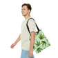 A man walks with a steady pace while he pleasantly wears the Marijuana Leaves Green Tote Bag