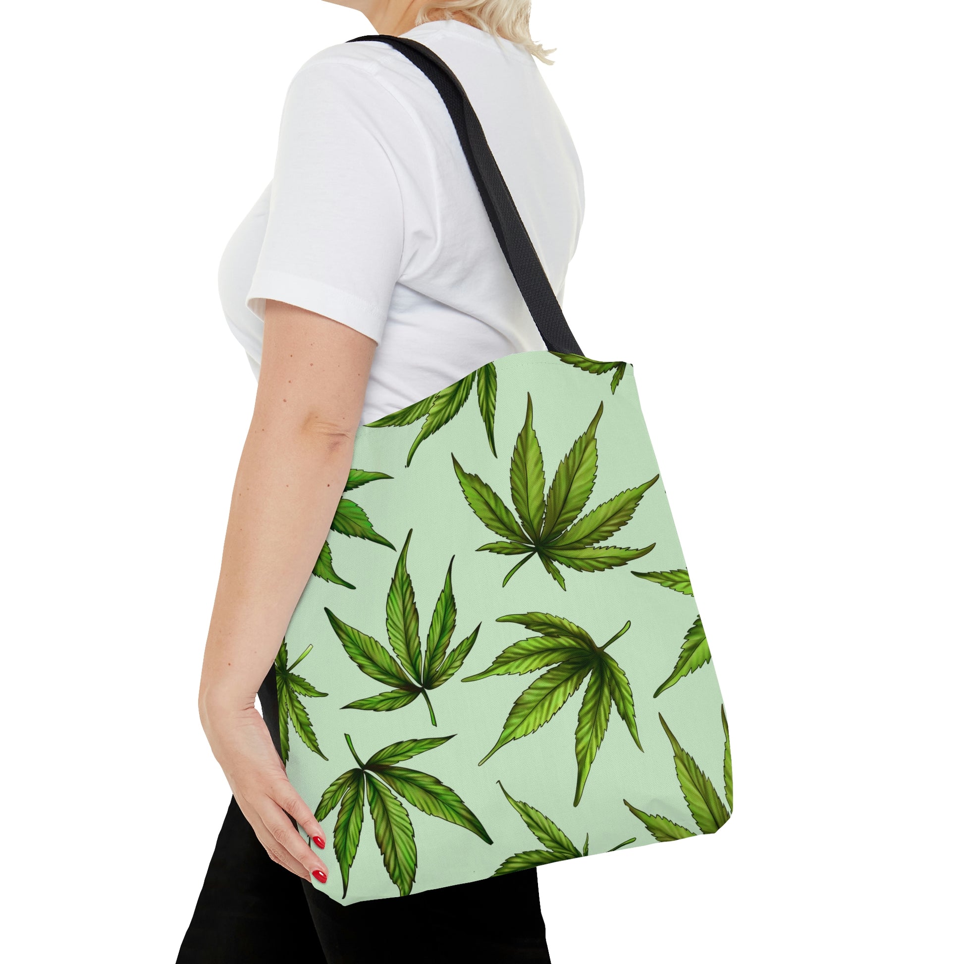 A woman is on her way as she wears the Marijuana Leaves Green Tote Bag