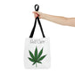 a hand with red painted finger nails is holding the Self Care Cannabis Tote Bag