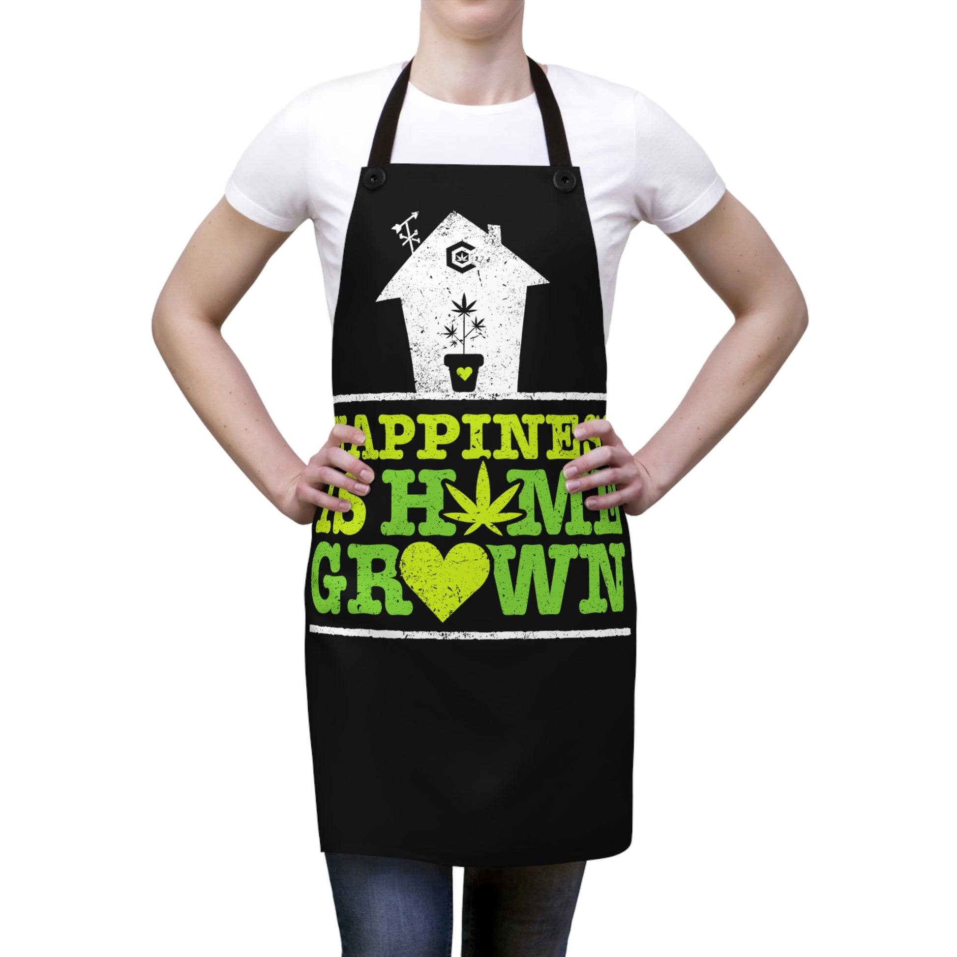 A woman has her hands down to the side as she wears the Happiness is Homegrown Chef's Apron