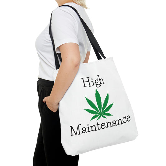 A woman in black pants has her hand in her pocket while she is wearing the High Maintenance Tote Bag with bud leaf