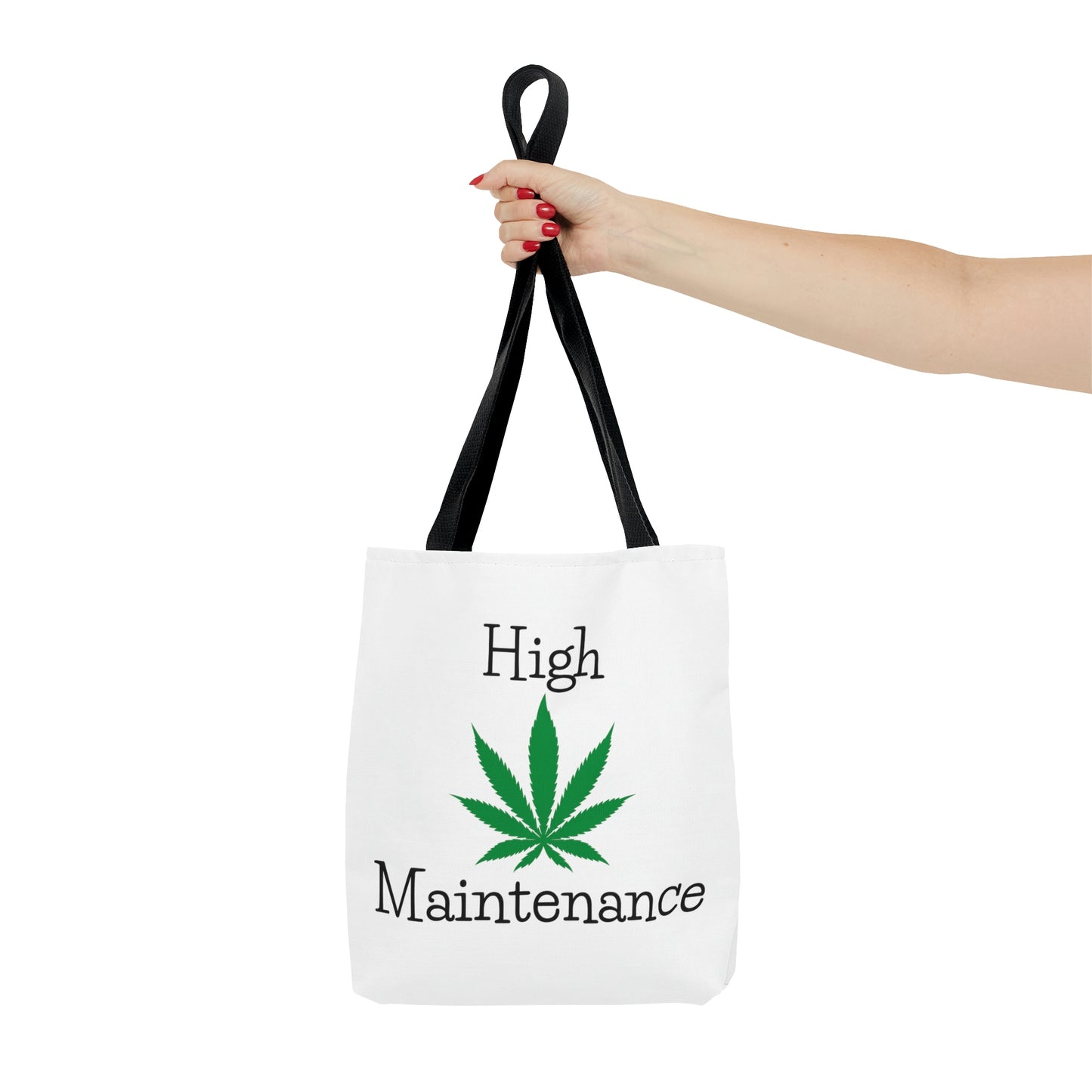 An outstretched hand is holding the High Maintenance Weed Tote Bag with cannabis leaf
