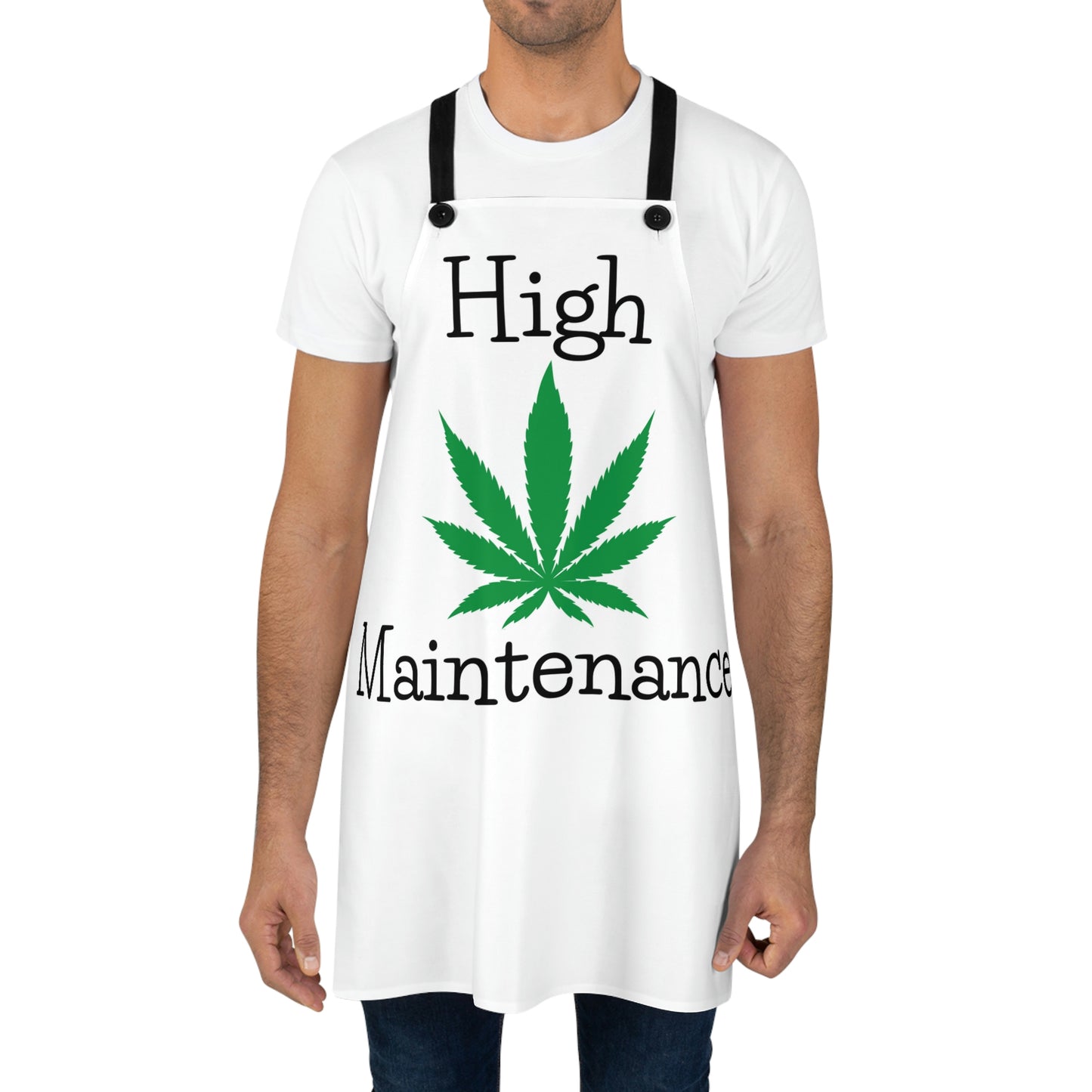 A man is wearing the High Maintenance Marijuana Chef's Apron with green cannabis leaf in the center