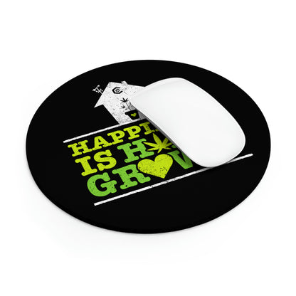 A computer mouse on a Happiness is Homegrown Mouse Pad featuring a graphic with a house and the phrase "happiness is how you grow.