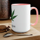 A white and pink "I'm Vegan" cannabis coffee mug on a wooden table with a macaroon and a silver spoon