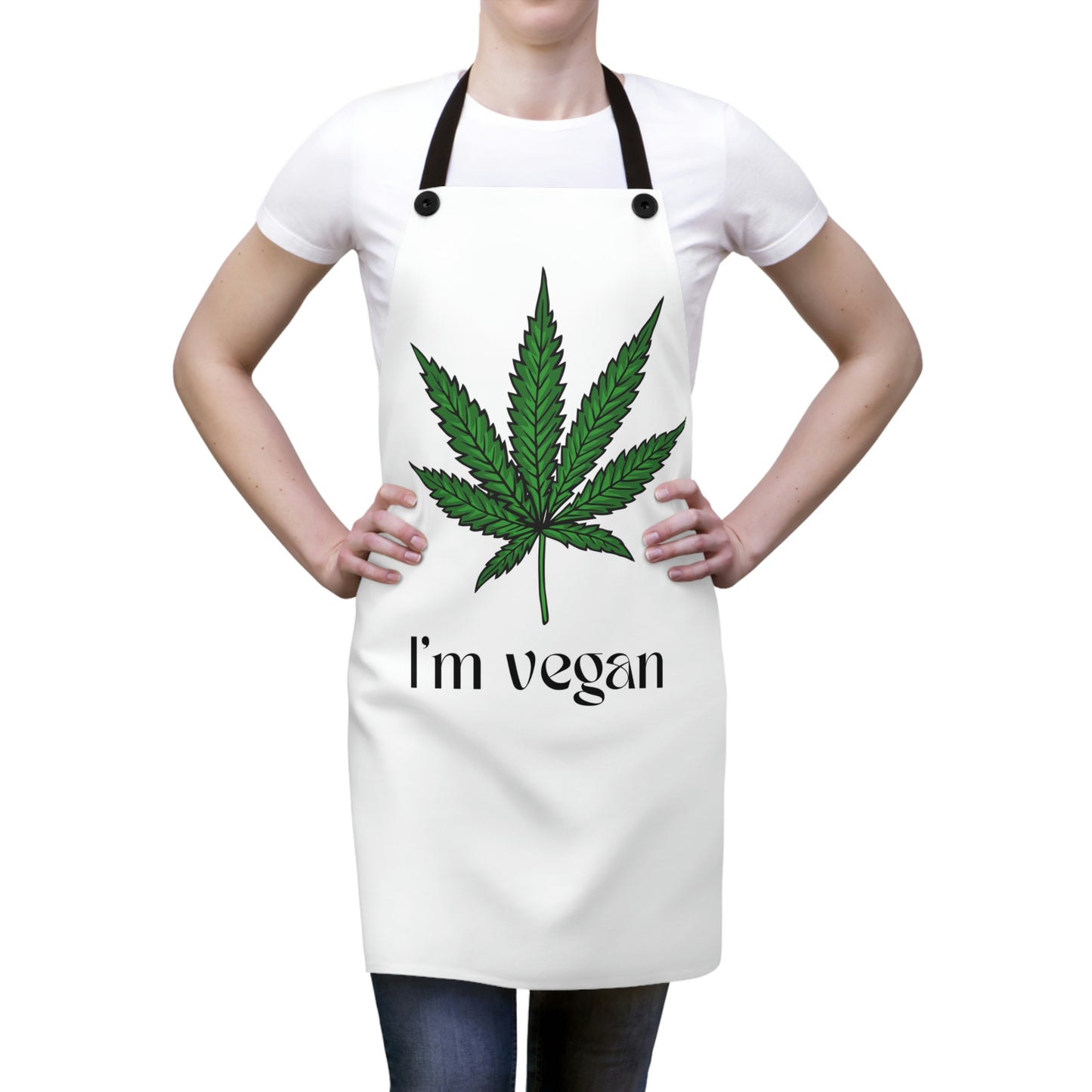 A woman models the I'm Vegan Weed Leaf Chef's Apron with large green cannabis leaf in the middle 