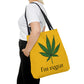 A woman is wearing black jeans with a white t shirt while flaunting the I'm Vegan Yellow Ganja Tote Bag 