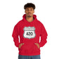A young man wearing a red Interstate 420 marijuana hoodie with his hands in his hoodie pocket