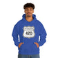A young man wearing a blue Interstate 420 marijuana hoodie with his hands in his hoodie pocket