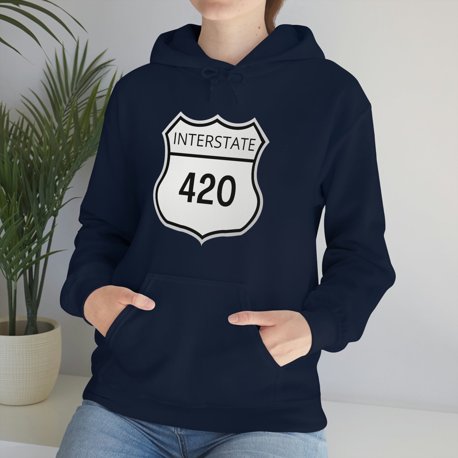 A woman wearing a navy blue Interstate 420, weed hoodie