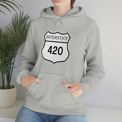 A person wearing an Interstate 420 Stoner Hoodie, featuring a gray design 