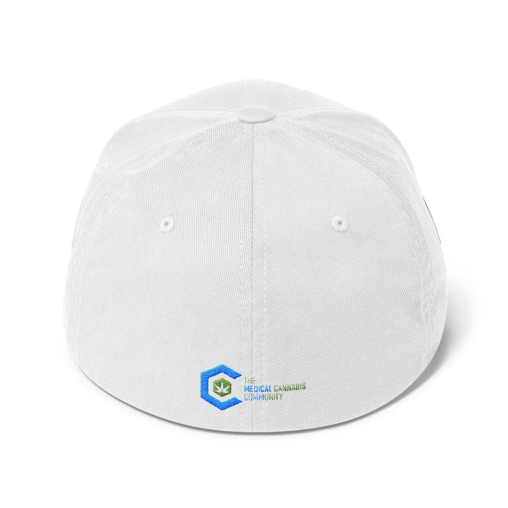 a white snapback hat showing The Medical Cannabis Community logo and has The Medical Cannabis Community stitched next to the logo on back
