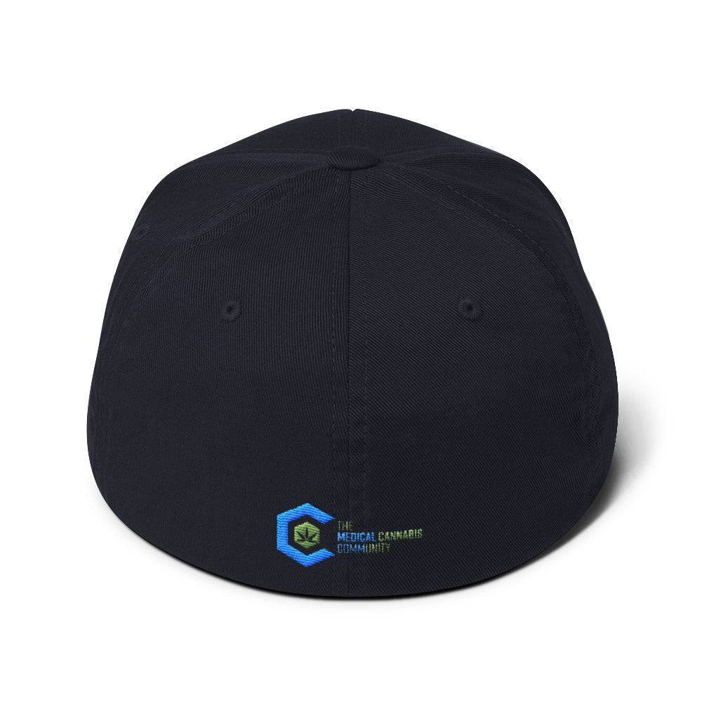 a dark navy blue snapback hat showing The Medical Cannabis Community logo and has The Medical Cannabis Community stitched next to the logo on back