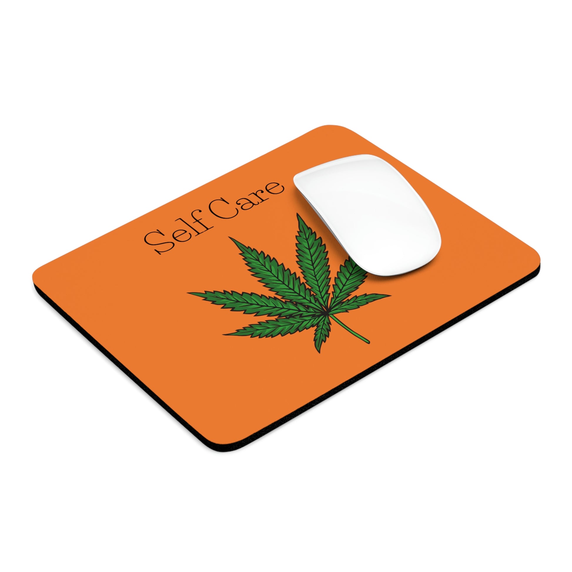 The added white mouse makes the Self Care Cannabis Mouse Pad look so cool on this side angled photo.