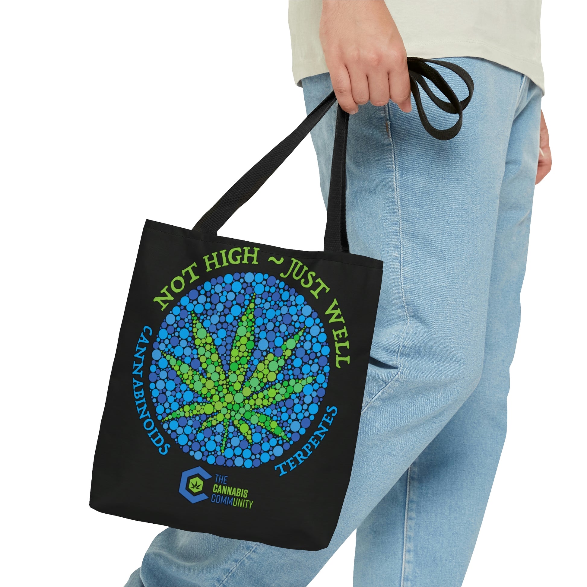 A man is headed towards a destination while he is wearing the Not High, Just Well Medical Cannabis Tote Bag with weed leaf in center