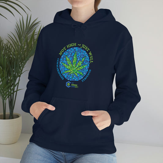 A woman wearing a navy blue "Not High, Just Well Cannabis Hoodie" with a marijuana leaf on it.