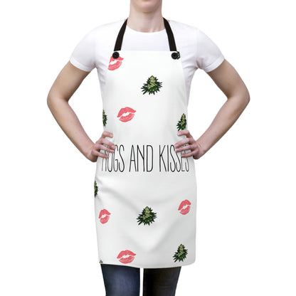 A woman wears the Nugs and Kisses Chef's Apron with green nugs and pink kisses  