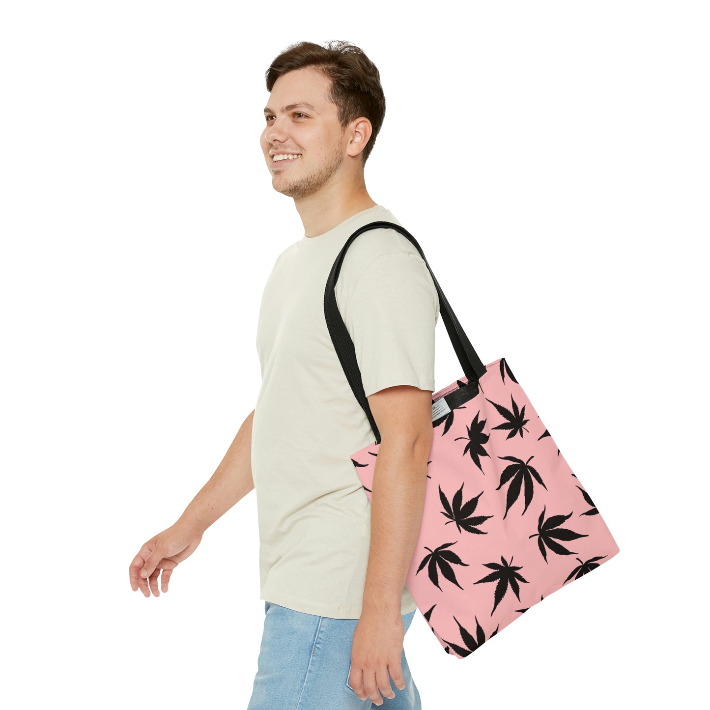 A man is smiling with his new Marijuana Leaves Pink Tote Bag