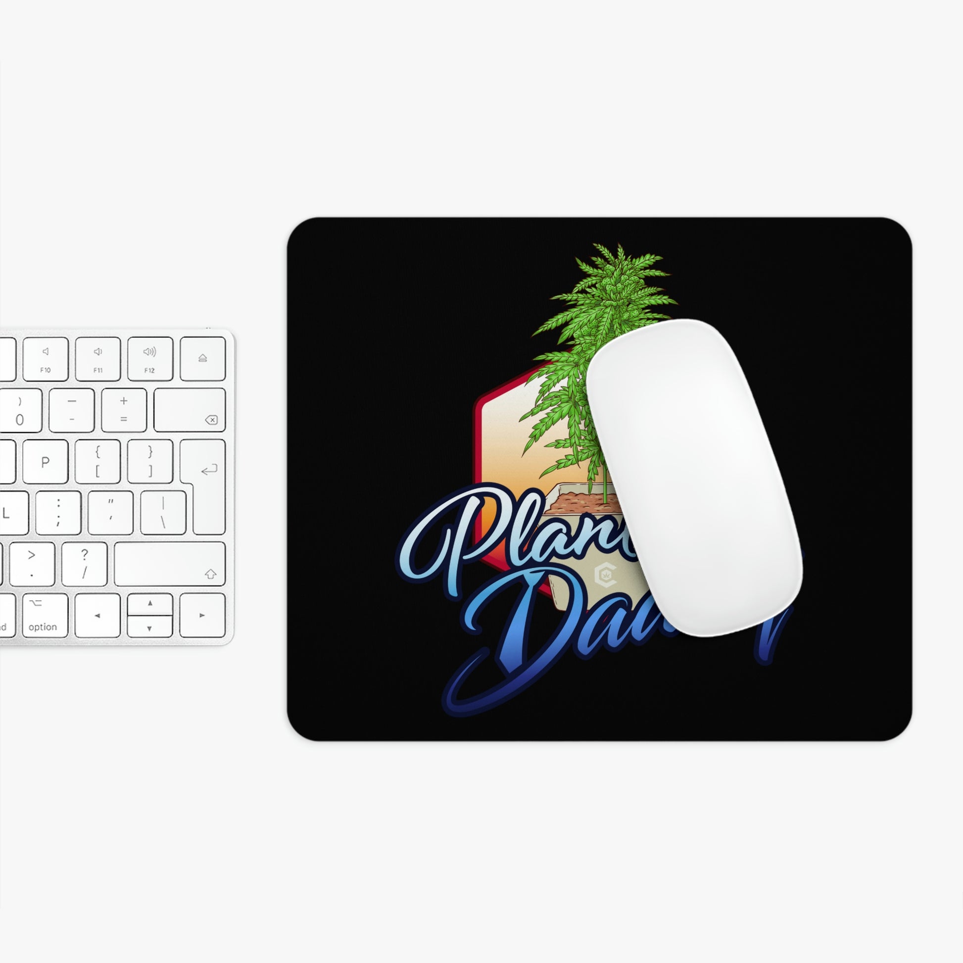 A flat view of the Plant Daddy Cannabis Mouse Pad with a mouse to show a great finished look.