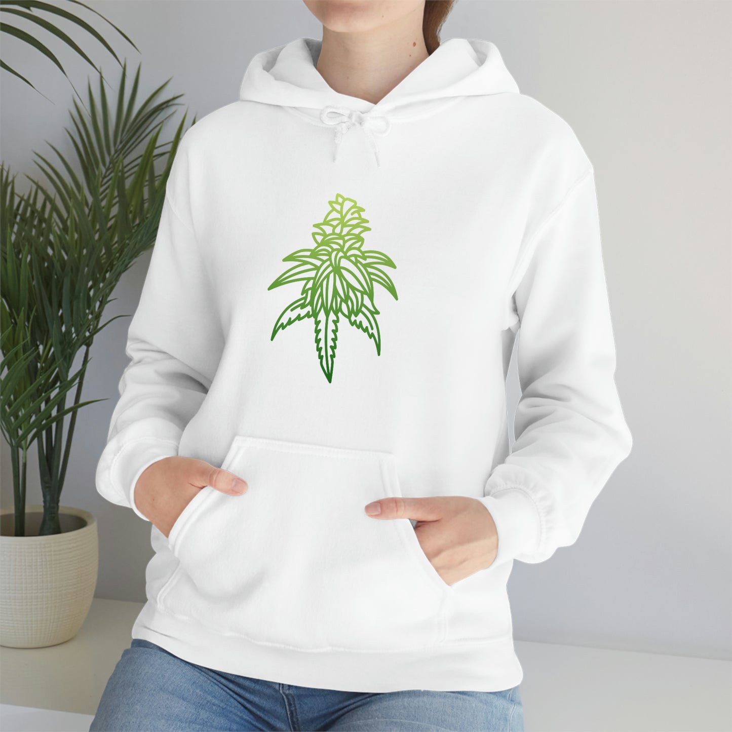 a woman wearing a white Sour Diesel Marijuana Hoodie with a green cannabis leaf on it.
