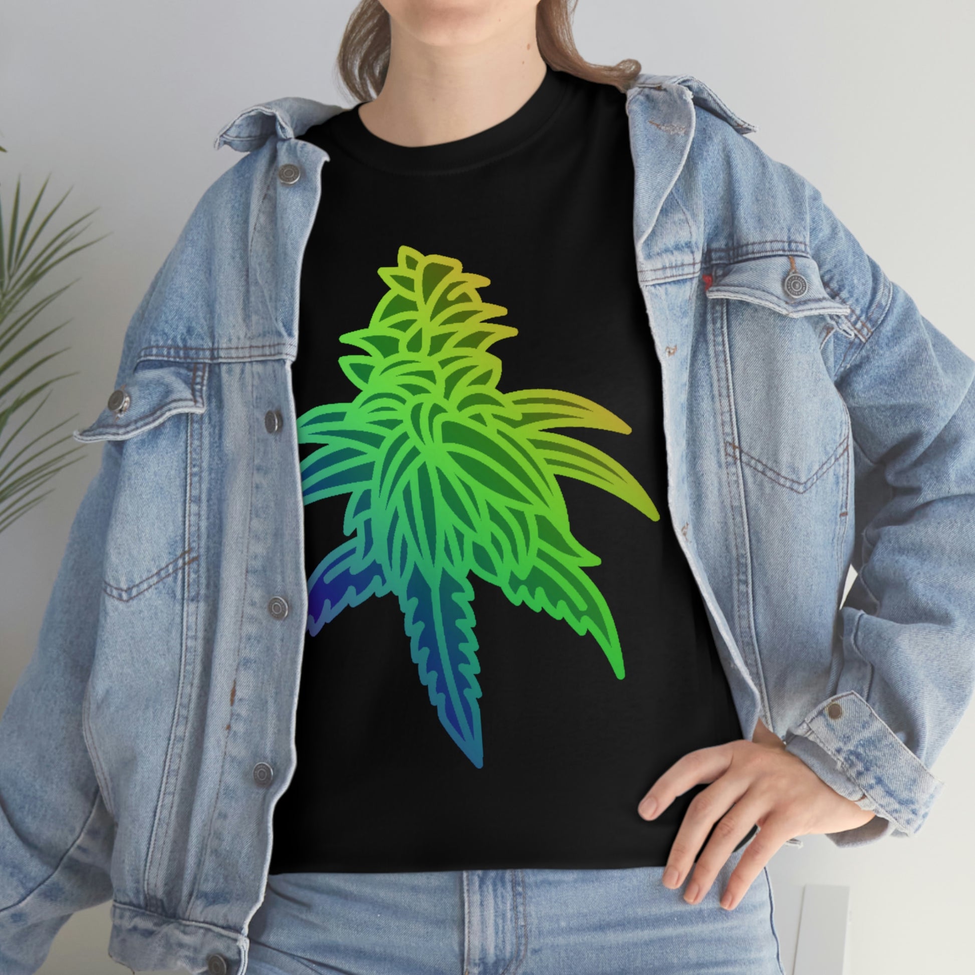 A woman wearing a Rainbow Sherbet Cannabis Tee with a colorful marijuana leaf on it.