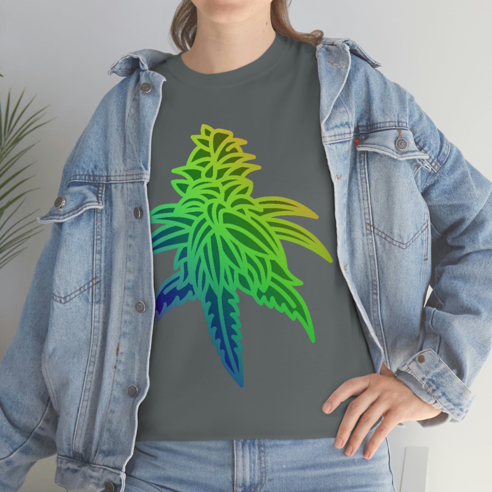 a woman wearing a Rainbow Sherbet Cannabis Tee with a colorful marijuana leaf on it.