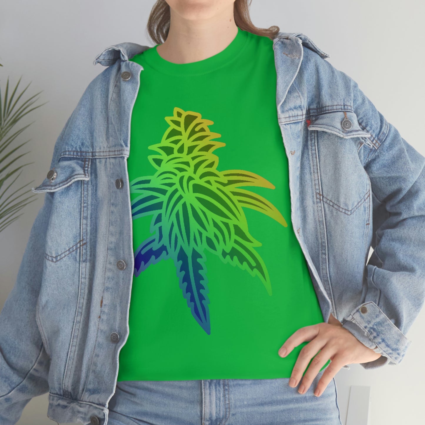 a woman wearing a Rainbow Sherbet Cannabis Tee with a marijuana leaf on it.