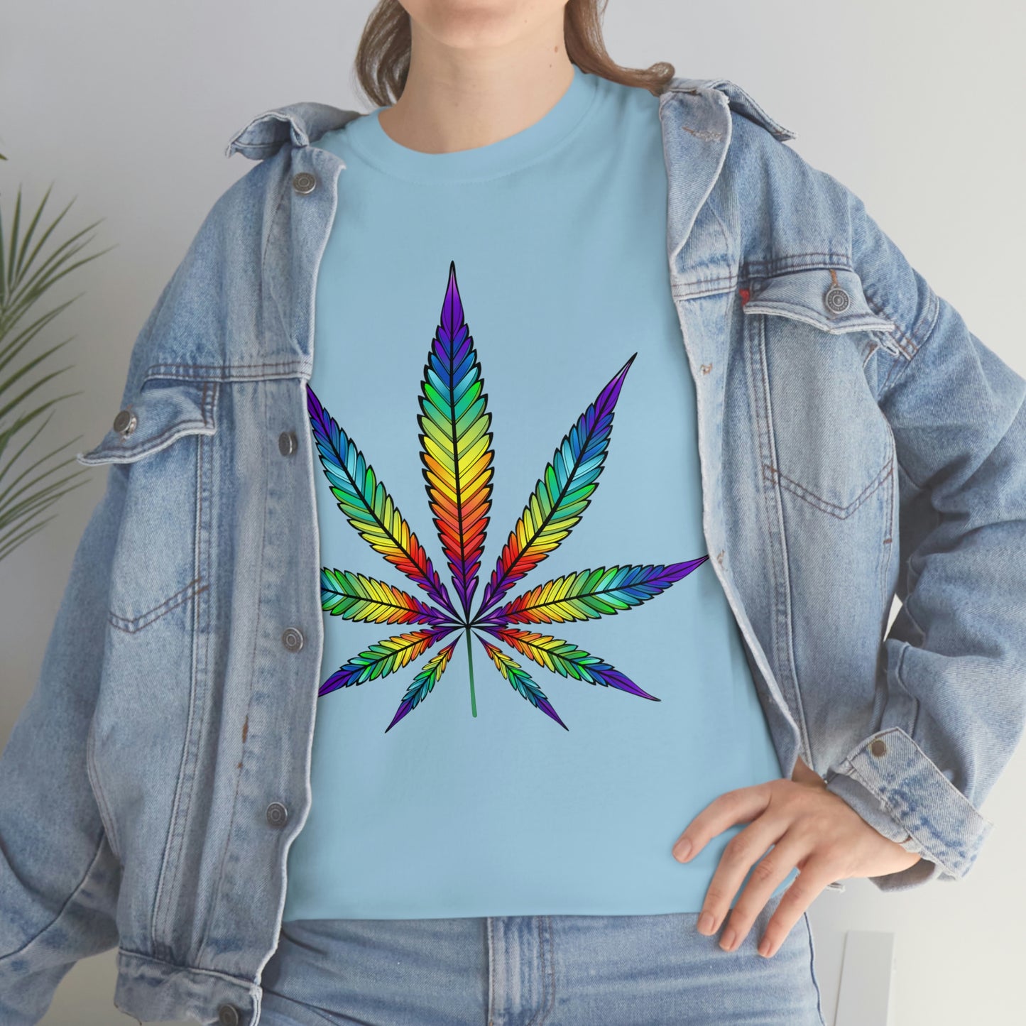 A woman wearing a Rainbow Cannabis Leaf Tee