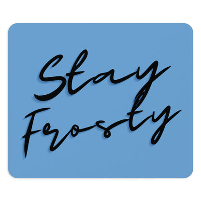 The Stay Frosty Blue Mouse Pad is a blue mouse pad with the phrase "stay frosty" written in stylish black cursive script.