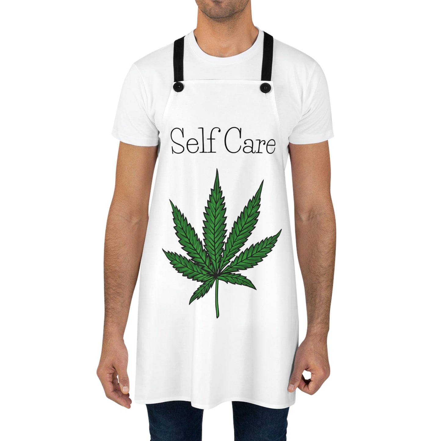 Man in the Self Care Weed Leaf Chefs Apron with green marijuana leaf in the middle