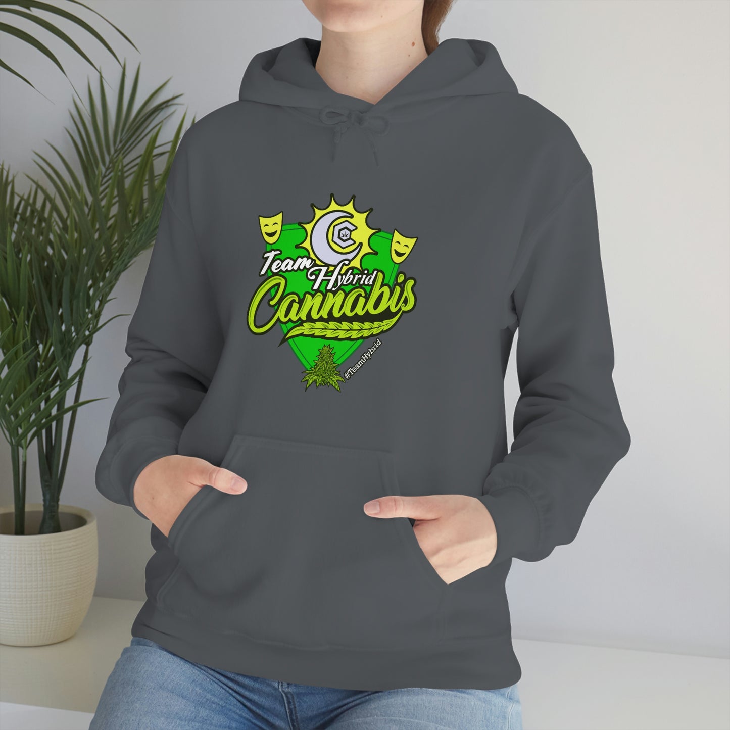 a woman wearing a gray hoodie with the word Team Hybrid Cannabis on it.
