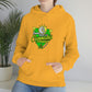 A woman wearing a yellow Team Hybrid Cannabis Pullover Hoodie with the word cannabis on it.