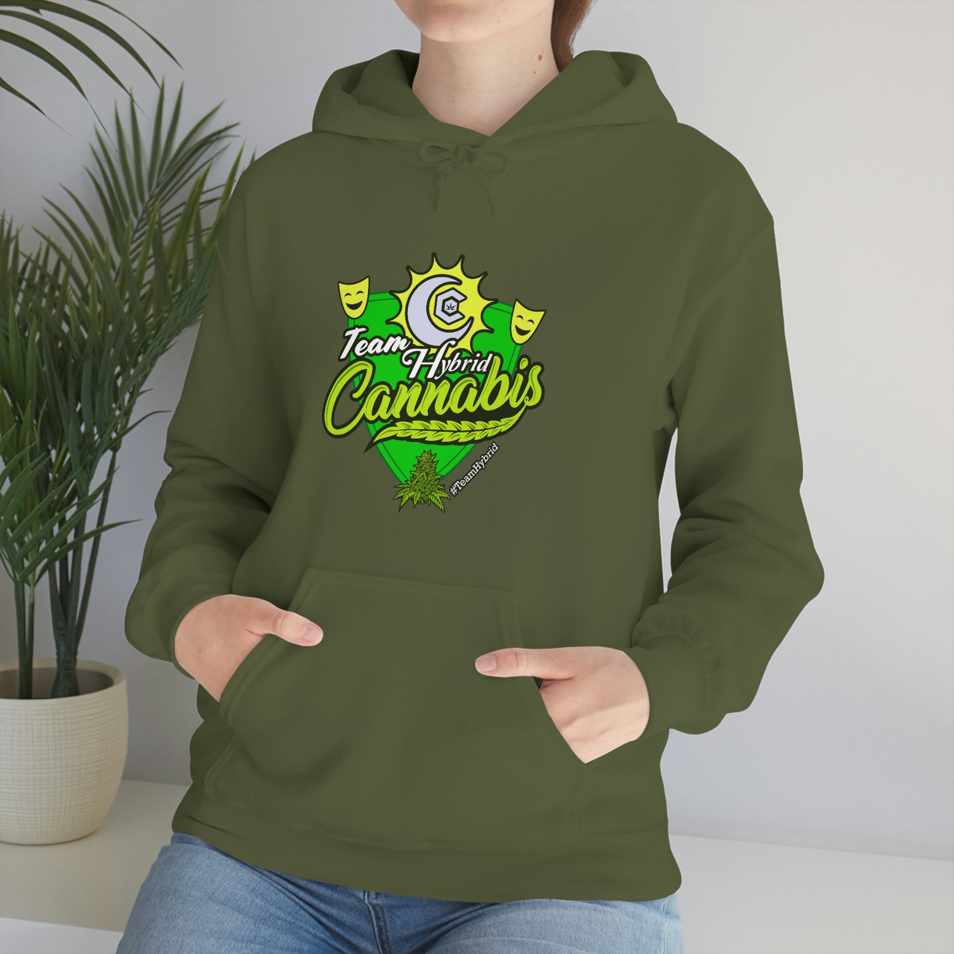 a woman wearing a green Team Hybrid Cannabis Pullover Hoodie.