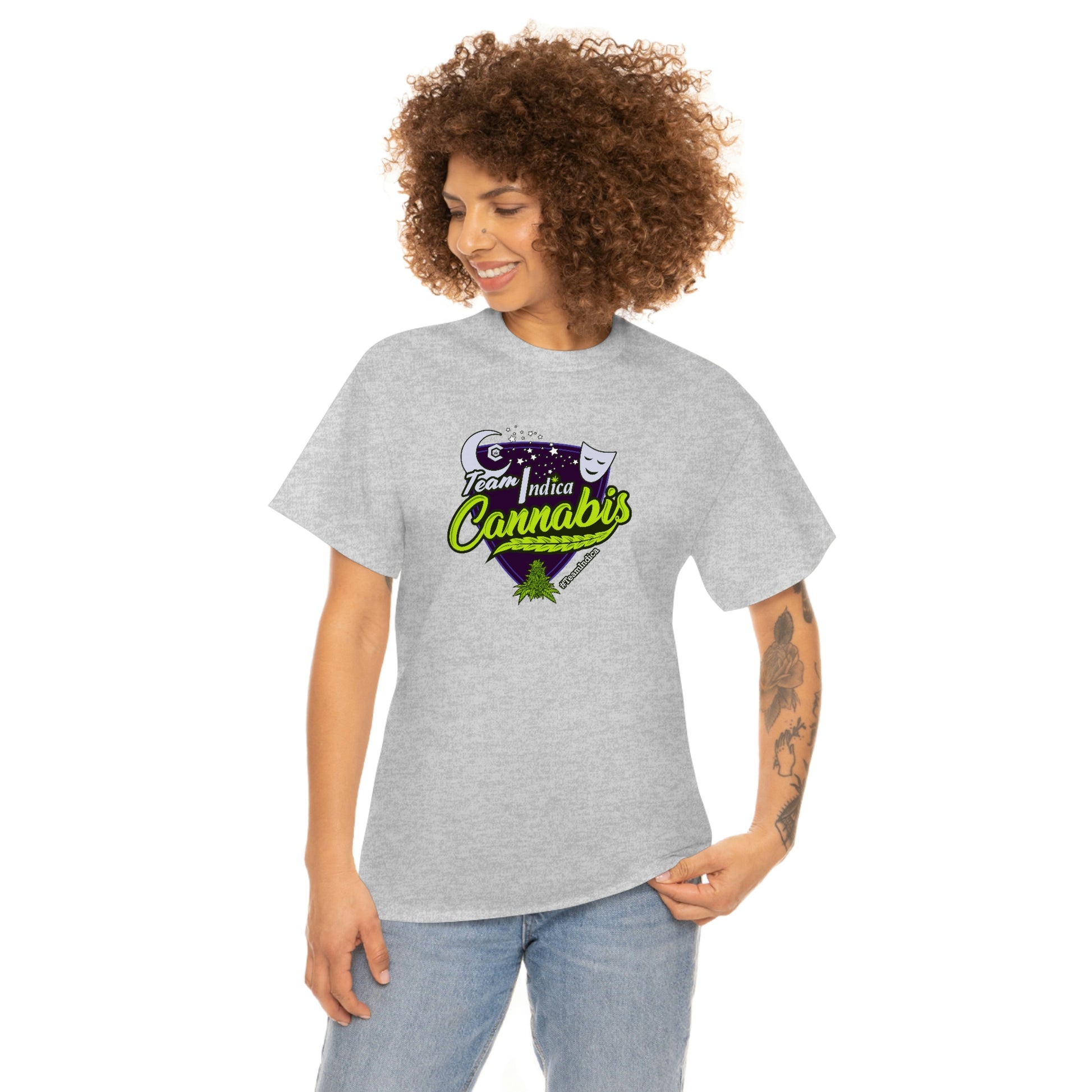 a woman wearing a Team Indica Cannabis T-Shirt with a green and purple logo.