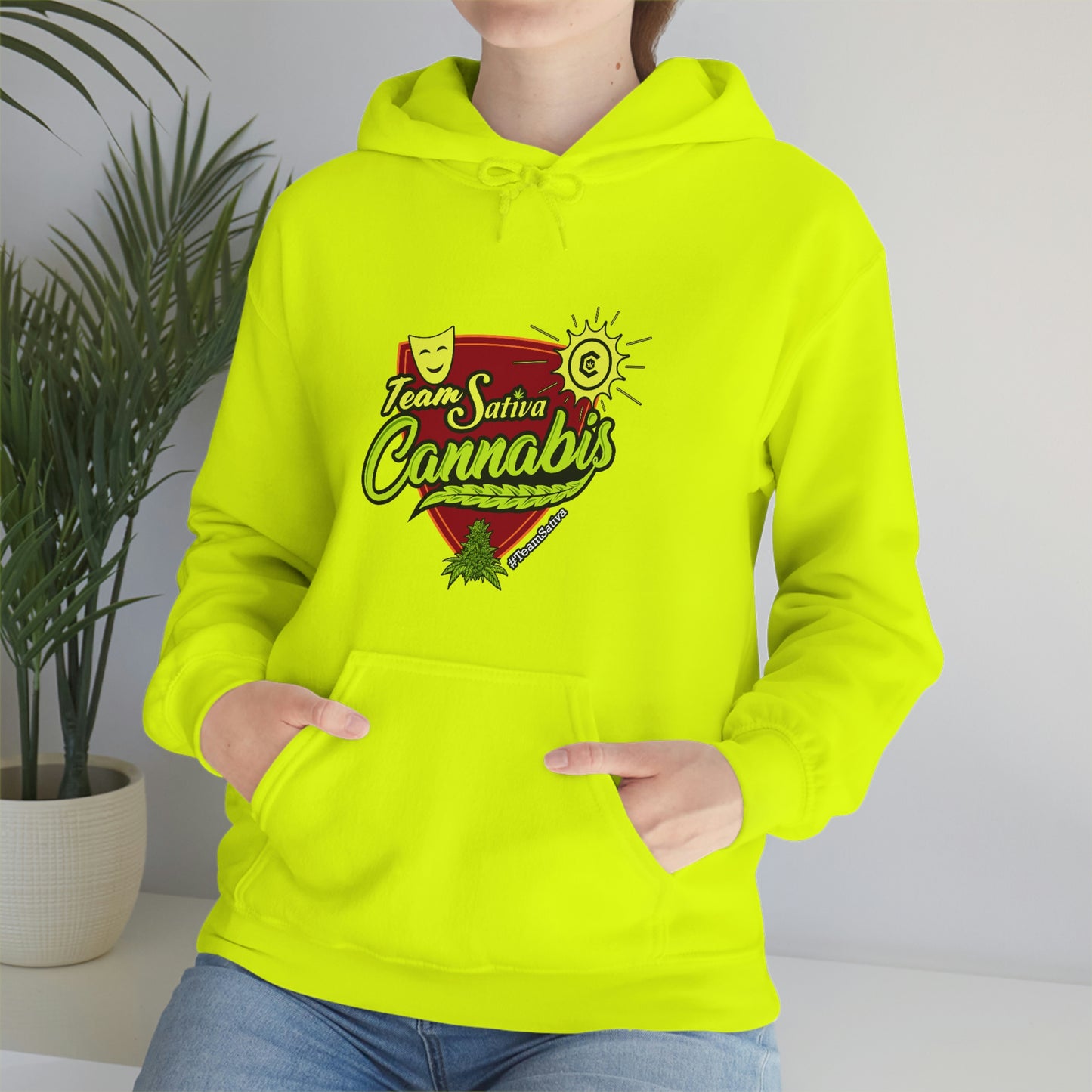 a woman wearing a neon yellow Team Sativa Stoner Sweatshirt with the word cannabis on it.
