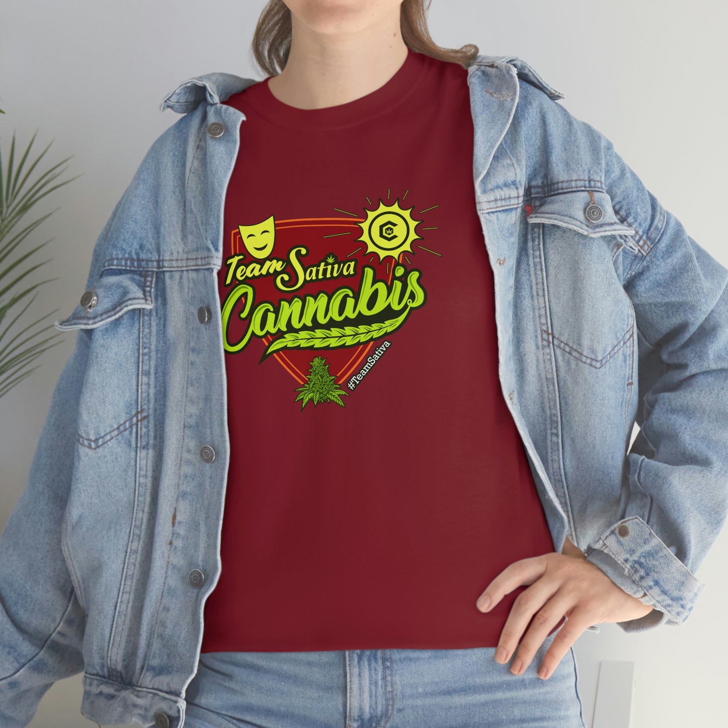 A woman wearing a red Team Cannabis Sativa Shirt that says i love cannabis.