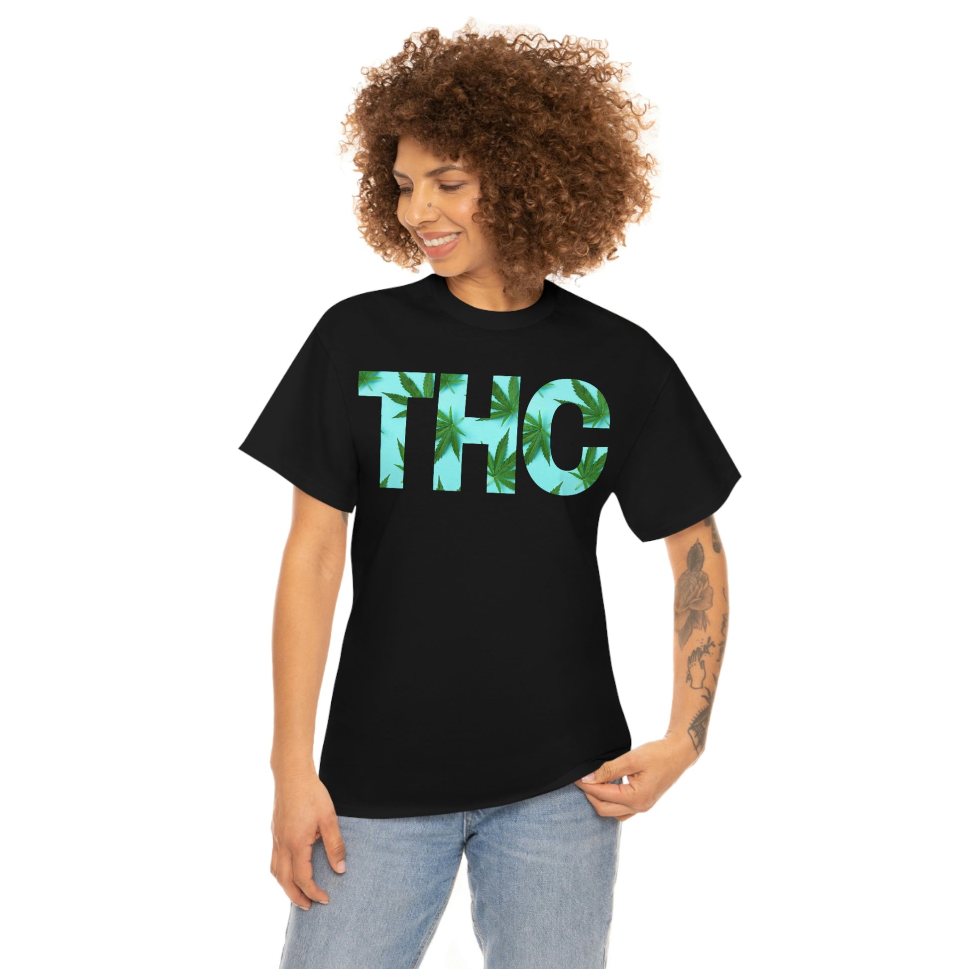 a woman wearing a black t-shirt with the Turquoise THC Tee on it.