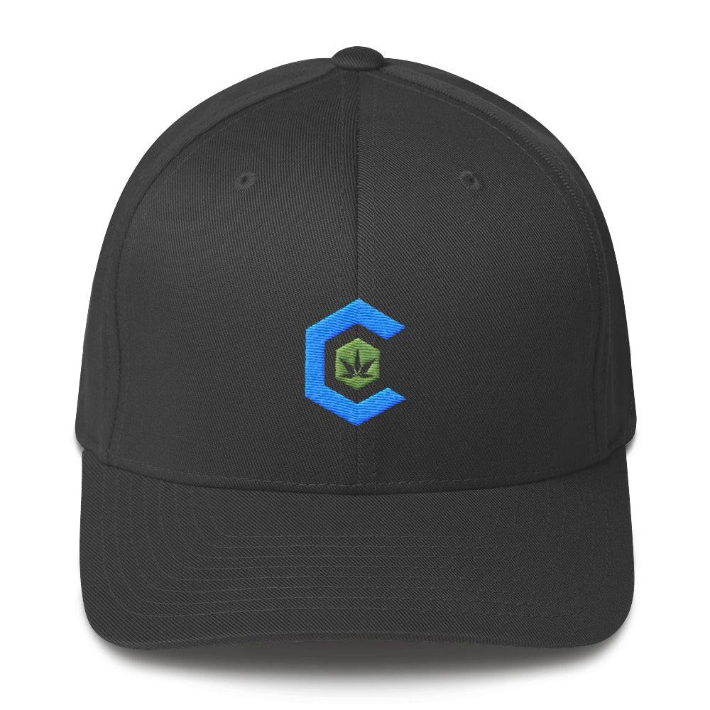 A dark gray snapback hat that shows the cannabis community logo on the front.