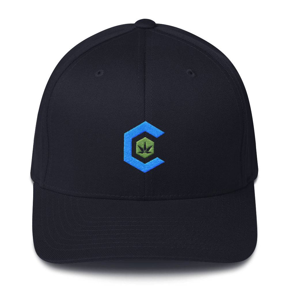 A dark navy blue snapback hat that shows the cannabis community logo on the front.