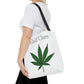 A woman is grasping her Self Care Cannabis Tote Bag as she walks