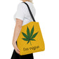 A woman walks successfully while holding the I'm Vegan Yellow Ganja Tote Bag 