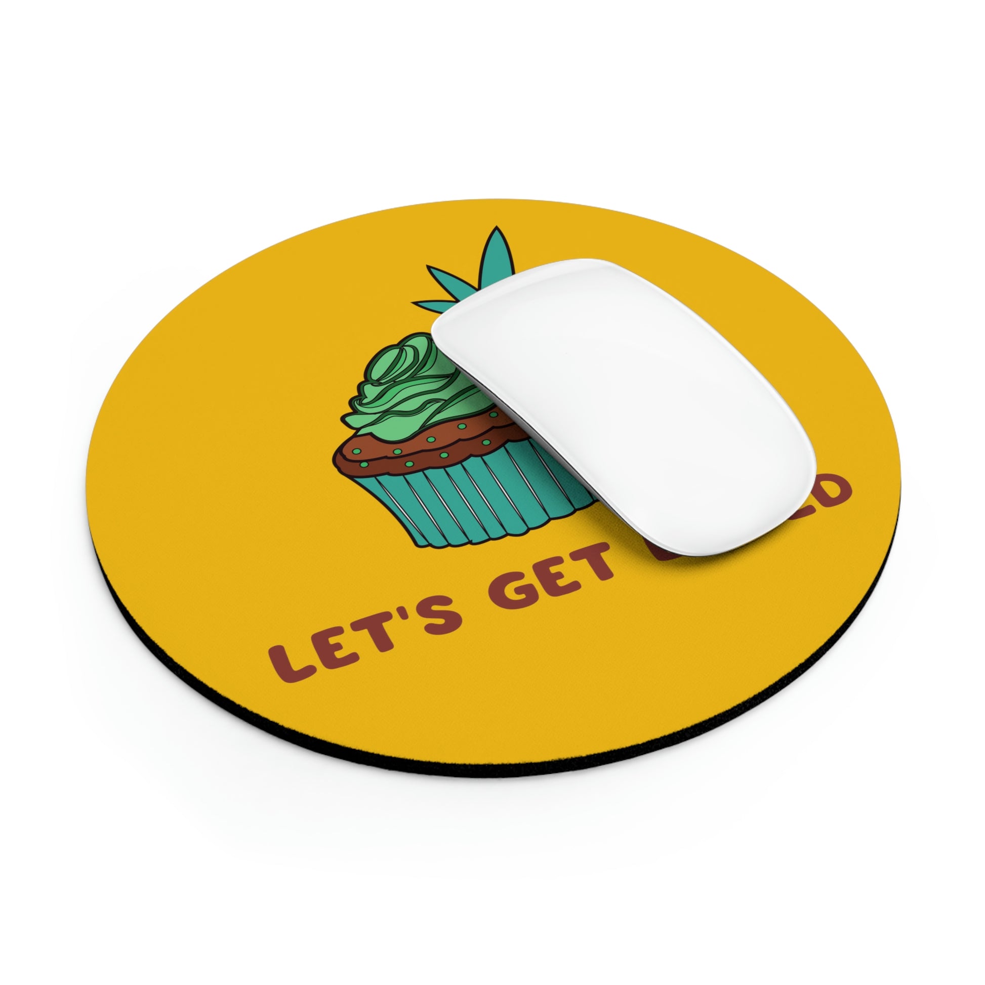 This round yellow Let's Get Baked Mouse Pad is in use with a white mouse covering part of the graphic to show the purchaser how it will look for personal use.
